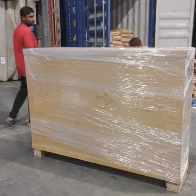 Our team loading a shipping container at the warehouse