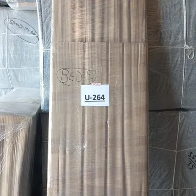 A bed professionally wrapped and labeled for shipment
